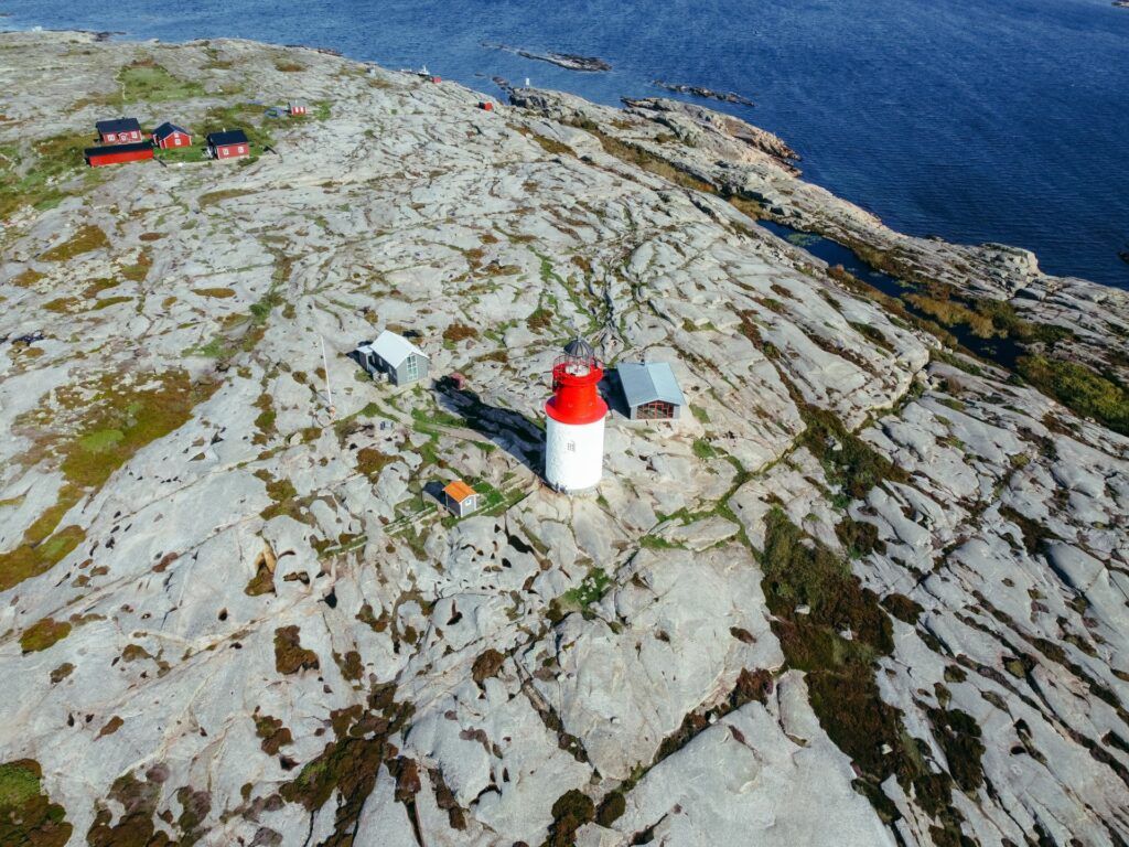 Aerial view of Hållö island, in the center the red and white lighthouse is seen.