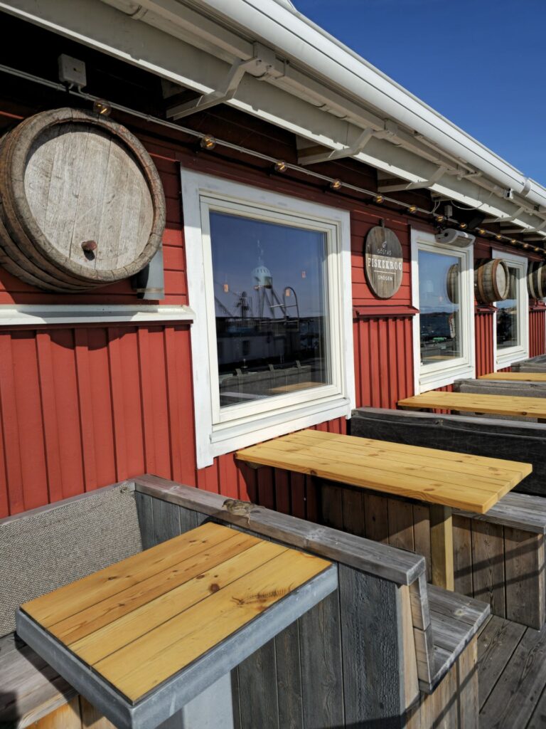 Göstas Fiskekrog, red building with tables outside
