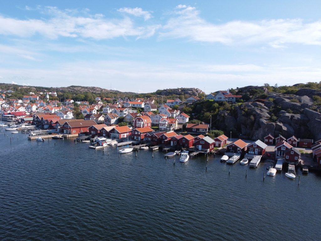 Aerial view of Bovallstrand harbour and red boathouses along the Swedish west coast.