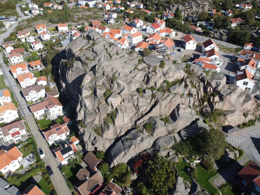 Large granite cliff rising in the middle of Bovallstrand village.